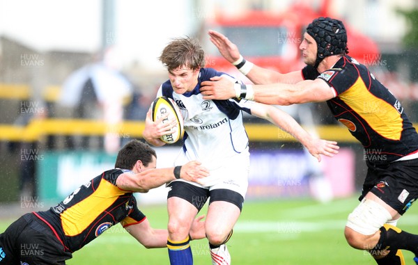 16.05.09 - Newport Gwent Dragons v Leinster, Magners League -  Leinster's Kyle Tonetti is tackled by Dragons' Luke Charteris (rt) and Rhodri Gomer Davies  