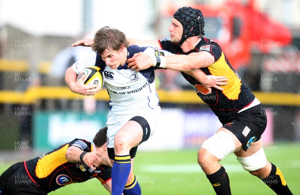 16.05.09 - Newport Gwent Dragons v Leinster, Magners League -  Leinster's Kyle Tonetti is tackled by Dragons' Luke Charteris (rt) and Rhodri Gomer Davies  