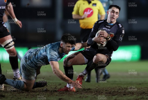 190221 - Dragons v Leinster - Guinness PRO14 - Sam Davies of Dragons is tackled by Ross Byrne of Leinster