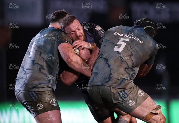 190221 - Dragons v Leinster - Guinness PRO14 - Greg Bateman of Dragons is tackled by Peter Dooley and Ryan Baird of Leinster