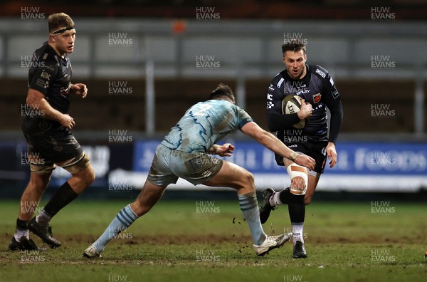 190221 - Dragons v Leinster - Guinness PRO14 - Josh Lewis of Dragons is tackled by Ross Byrne of Leinster