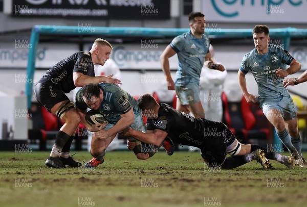 190221 - Dragons v Leinster - Guinness PRO14 - Peter Dooley of Leinster is tackled by Ben Fry and Matthew Screech of Dragons
