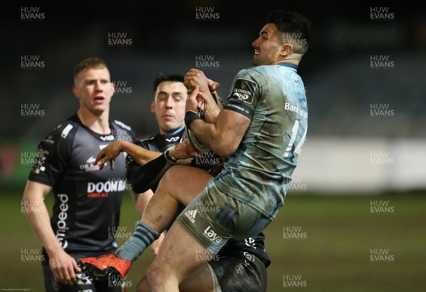 190221 - Dragons v Leinster, Guinness PRO14 - Cian Kelleher of Leinster takes the ball under pressure from Sam Davies of Dragons
