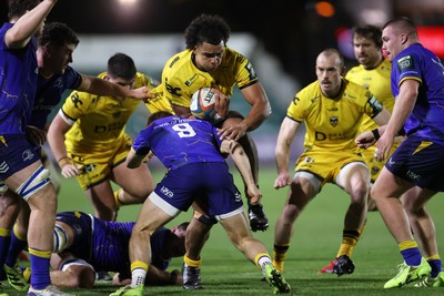 281125 - Dragons RFC v Leinster - United Rugby Championship - Mackenzie Martin of Dragons is tackled by Max Deegan of Leinster 