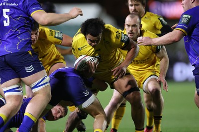281125 - Dragons RFC v Leinster - United Rugby Championship - Mackenzie Martin of Dragons is tackled by Max Deegan of Leinster 