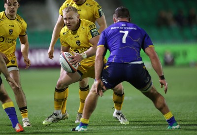 281125 - Dragons RFC v Leinster - United Rugby Championship - Tinus de Beer of Dragons is challenged by Scott Penny of Leinster 