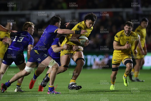 281125 - Dragons RFC v Leinster - United Rugby Championship - Mackenzie Martin of Dragons is tackled by Max Deegan of Leinster 