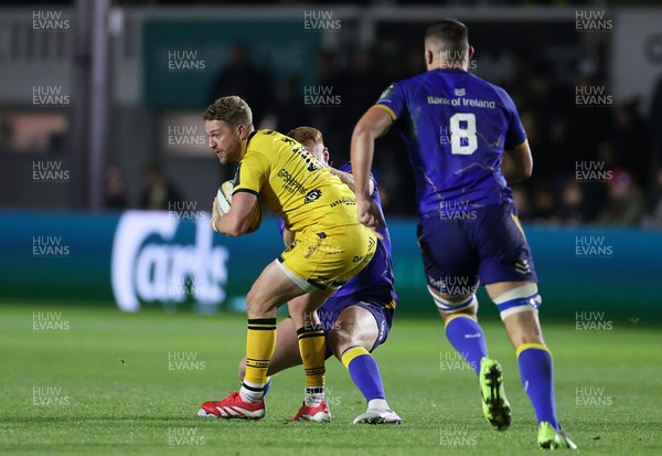 281125 - Dragons RFC v Leinster - United Rugby Championship - Angus O�Brien of Dragons is tackled by Ciaran Frawley of Leinster 