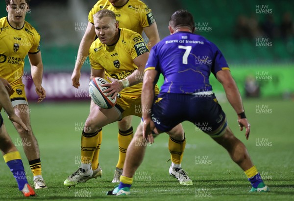 281125 - Dragons RFC v Leinster - United Rugby Championship - Tinus de Beer of Dragons is challenged by Scott Penny of Leinster 