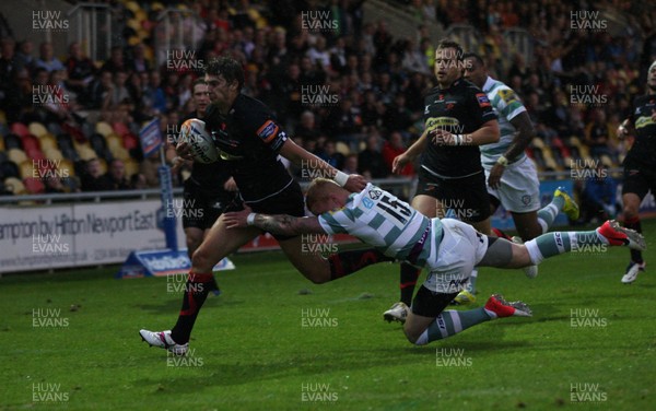 170812 - Newport Gwent Dragons v London Irish, Pre-season Friendly - Dragons Steffan Jones beats London Irish's Tom Homer to score try  