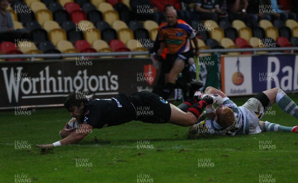 170812 - Newport Gwent Dragons v London Irish, Pre-season Friendly - Dragons Steffan Jones beats London Irish's Tom Homer to score try  