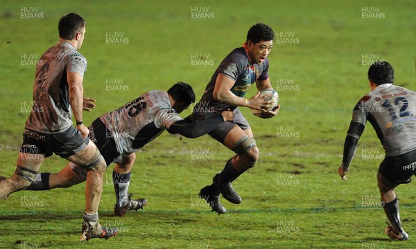 161212 - Newport-Gwent Dragons v Mogliano - Amlin Challenge Cup -Toby Faletau of Newport-Gwent Dragons is tackled by Gianluca Ceneda of Mogliano