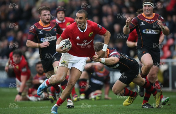 061215 - Newport Gwent Dragons v Munster, Guinness PRO12 - Simon Zebo of Munster gets past the tackle from Carl Meyer of Newport Gwent Dragons