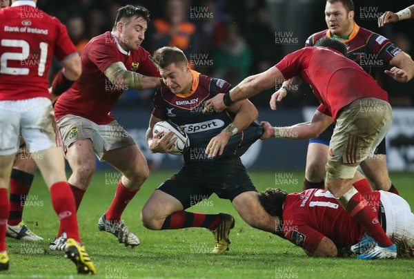 061215 - Newport Gwent Dragons v Munster, Guinness PRO12 - Carl Meyer of Newport Gwent Dragons is hauled down by the Munster defence