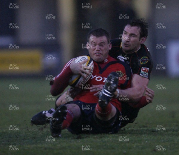 07.03.09 Gwent Dragons v Munster... Munster's Denis Fogarty is tackled by Joe Bearman. 