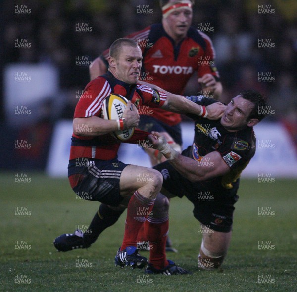 07.03.09 Gwent Dragons v Munster... Dragons' Joe Bearman  tackles Munster's Paul Warwick. 