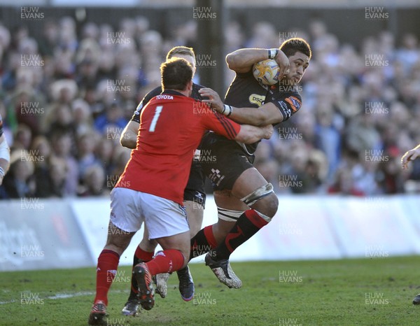 190413 - Newport Gwent Dragons v Munster - RaboDirect PRO12 -  Dragons Toby Faletau, right, is tackled by Munster's  Wian Du Preez