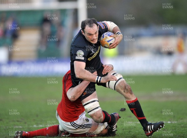 190413 - Newport Gwent Dragons v Munster - RaboDirect PRO12 -  Dragons Lewis Robling, right is tackled by Munster's Rob Sidoli 