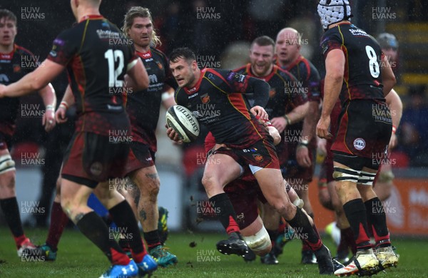 260119 - Dragons v Munster - Guinness PRO14 - Josh Lewis of Dragons is tackled by Billy Holland of Munster