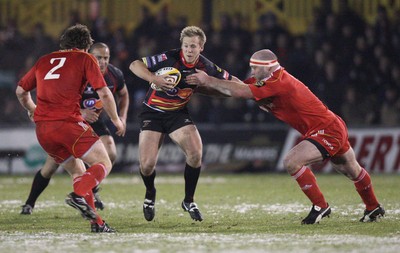 26.11.10...Newport Gwent Dragons v Munster, Magners League -  Dragons' Ashley Smith holds off Munster's John Hayes  