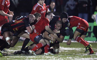 26.11.10...Newport Gwent Dragons v Munster, Magners League -  Munster's Denis Hurley is tackled by Dragons' Patrick Leach   