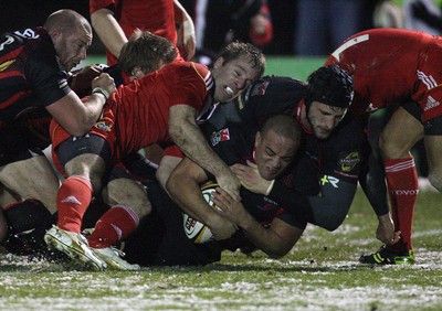 26.11.10...Newport Gwent Dragons v Munster, Magners League -  Munster's Denis Hurley is tackled by Dragons' Patrick Leach   