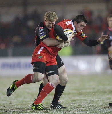 26.11.10...Newport Gwent Dragons v Munster, Magners League -  Munster's Denis Hurley is tackled by Dragons' Patrick Leach   