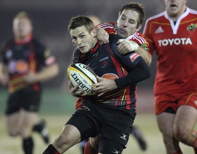 26.11.10...Newport Gwent Dragons v Munster, Magners League -  Dragons' Jason Tovey is tackled by Munster's Tomas O'Leary  