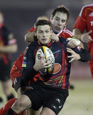 26.11.10...Newport Gwent Dragons v Munster, Magners League -  Dragons' Jason Tovey is tackled by Munster's Tomas O'Leary  