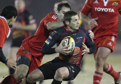 26.11.10...Newport Gwent Dragons v Munster, Magners League -  Dragons' Jason Tovey is tackled by Munster's Tomas O'Leary  