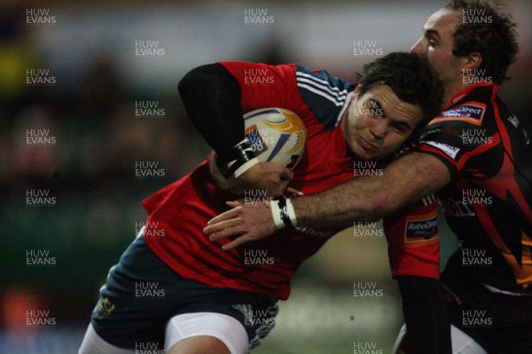 291113 - Newport Gwent Dragons v Munster, RaboDirect PRO12 - Munster's Gerhard Van Den Heever is tackled by Dragons Will Harries