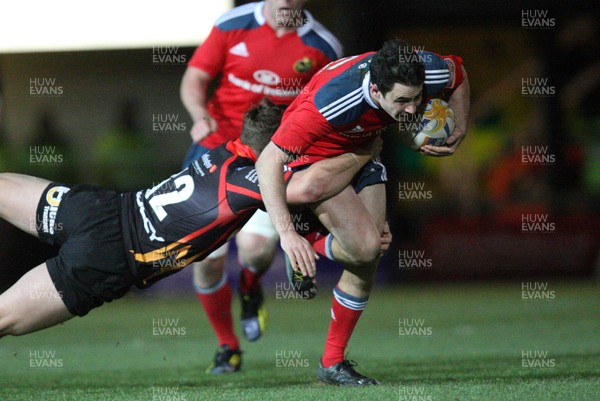 291113 - Newport Gwent Dragons v Munster, RaboDirect PRO12 - Munster's Felix Jones is tackled by Dragons Ross Wardle