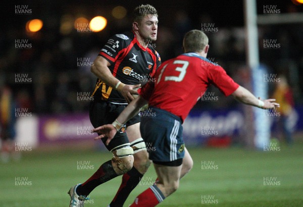 291113 - Newport Gwent Dragons v Munster, RaboDirect PRO12 - Dragons Lewis Evanstakes on Munster's Keith Earls