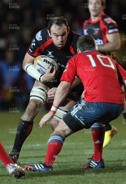 291113 - Newport Gwent Dragons v Munster, RaboDirect PRO12 - Dragons Rob Sidoli takes on Munster's Ian Keatley