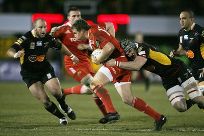 06.02.10 Dragons v Munster... Munster's Jean De Villiers is tackled by Dragons' Dan Lydiate . 