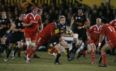 06.02.10 Dragons v Munster... Dragons' Wayne Evans  is tackled by Munster's Denis Fogarty. 