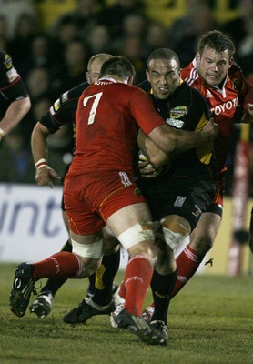 06.02.10 Dragons v Munster... Dragons' Gavin Thomas is tackled by Munster's Tommy O'Donnell. 