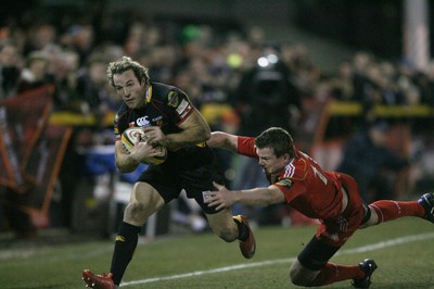 06.02.10 Dragons v Munster... Dragons' Will Harries beats Munster's Denis Hurley. 