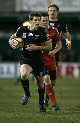 06.02.10 Dragons v Munster... Dragons' Jason Tovey is followed by Munster's Denis Hurley. 