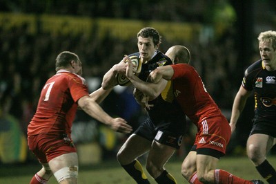 06.02.10 Dragons v Munster... Dragons' Jason Tovey is tackled by Munster's Tommy O'Donnell and Paul Warwick. 