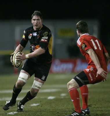 06.02.10 Dragons v Munster... Dragons' Adam Jones takes on Munster's Denis Hurley. 