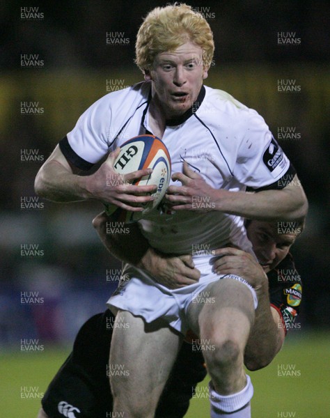 03.10.08 Dragons v Newcastle... Newcastle's Tom Dillon is tackled by Marc Stcherbina 