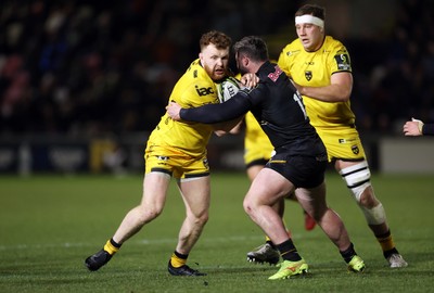 160126 - Dragons v Newcastle Red Bulls - European Rugby Challenge Cup - Aneurin Owen of Dragons is tackled by Sammy Arnold of Newcastle 