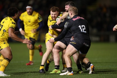 160126 - Dragons v Newcastle Red Bulls - European Rugby Challenge Cup - Aneurin Owen of Dragons is tackled by Sammy Arnold of Newcastle 