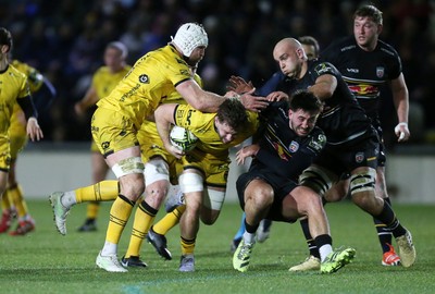 160126 - Dragons v Newcastle Red Bulls - European Rugby Challenge Cup - Thomas Young of Dragons is tackled by Ethan Grayson of Newcastle 