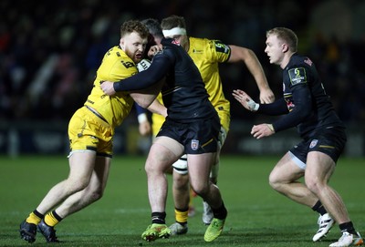 160126 - Dragons v Newcastle Red Bulls - European Rugby Challenge Cup - Thomas Young of Dragons is tackled by Ethan Grayson of Newcastle 