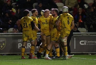 160126 - Dragons v Newcastle Red Bulls - European Rugby Challenge Cup - David Richards of Dragons celebrates scoring a try with team mates