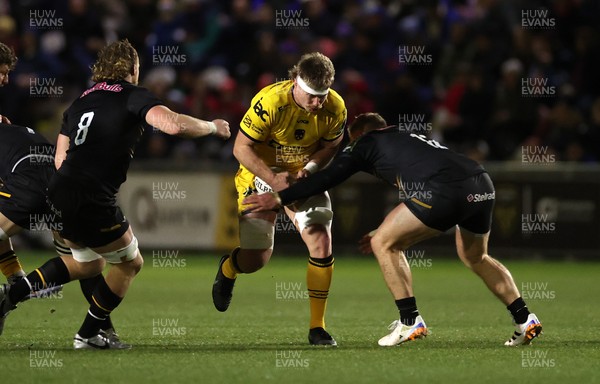 160126 - Dragons v Newcastle Red Bulls - European Rugby Challenge Cup - Aaron Wainwright of Dragons is tackled by Cameron Hutchison of Newcastle 