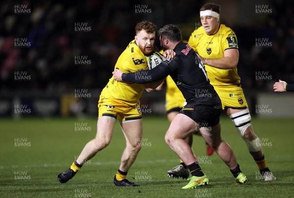 160126 - Dragons v Newcastle Red Bulls - European Rugby Challenge Cup - Aneurin Owen of Dragons is tackled by Sammy Arnold of Newcastle 
