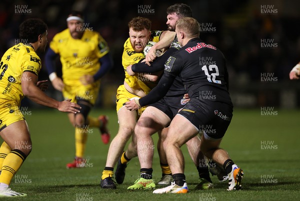 160126 - Dragons v Newcastle Red Bulls - European Rugby Challenge Cup - Aneurin Owen of Dragons is tackled by Sammy Arnold of Newcastle 